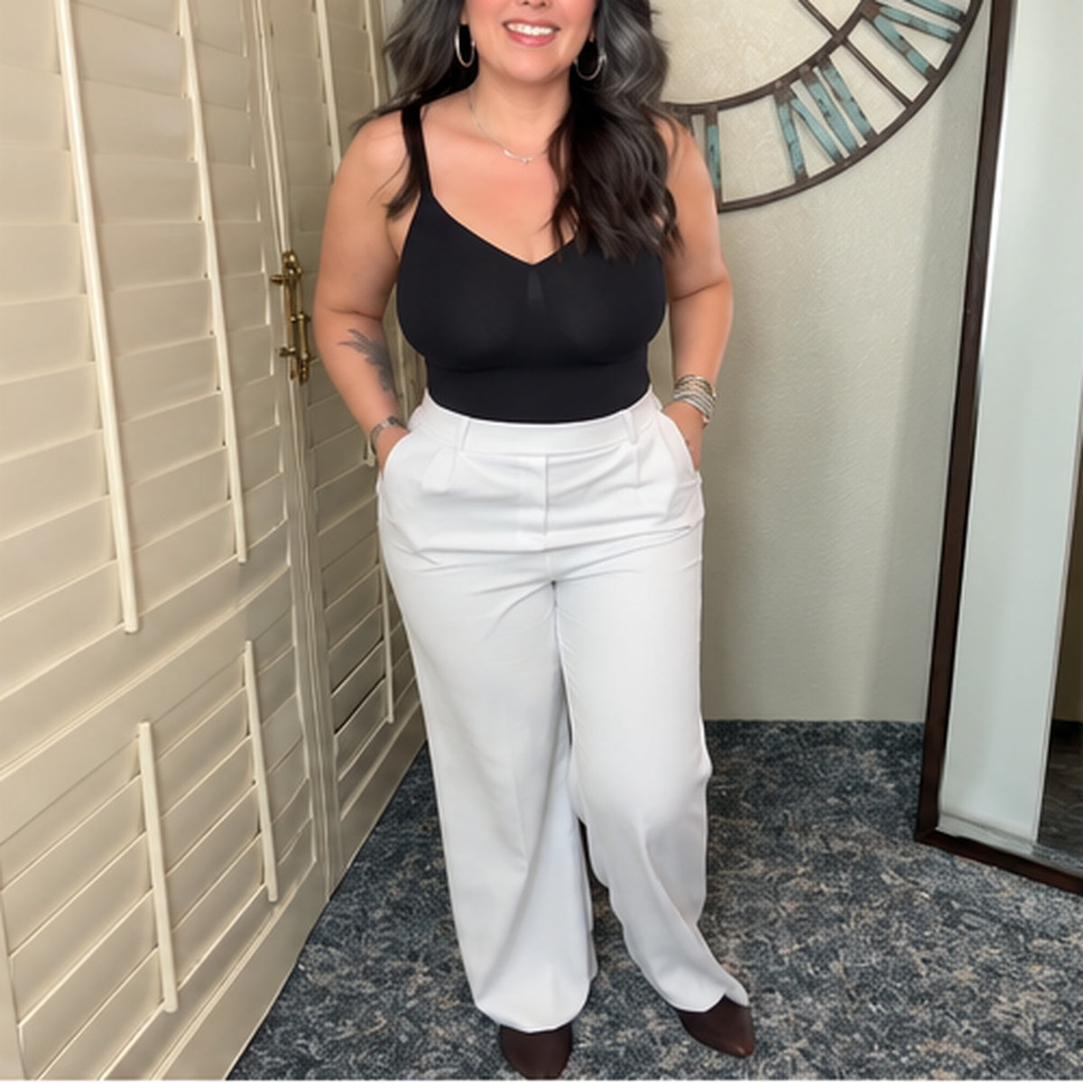 Black top styled with white trousers