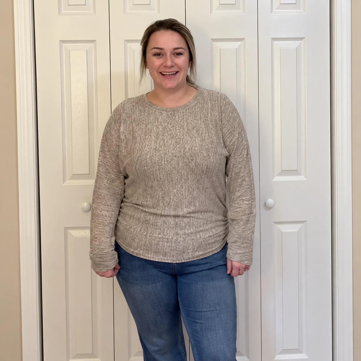 Taupe top showing the relaxed silhouette