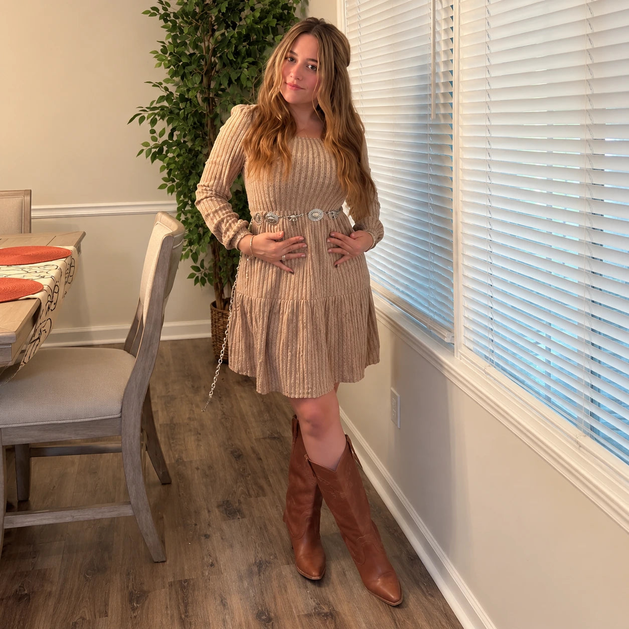 Taupe dress styled with a silver belt and brown boots