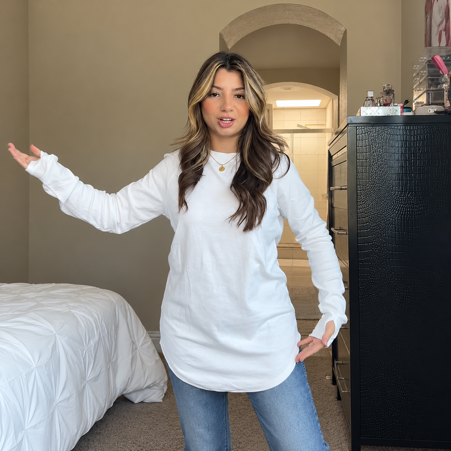 White crew-neck tunic styled with blue jeans