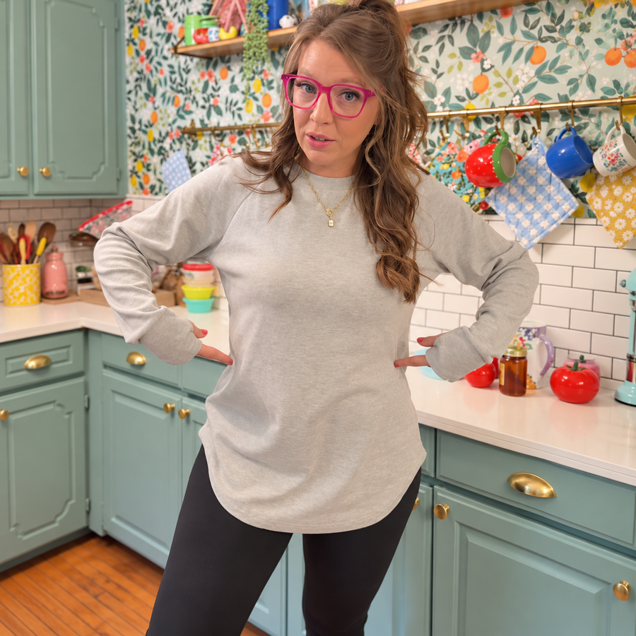 Oatmeal tunic with black leggings in a kitchen
