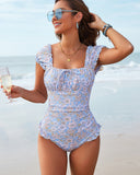 Traje de baño de una pieza con cuello cuadrado y estampado floral elegante con pareo